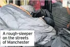  ??  ?? A rough-sleeper on the streets of Manchester