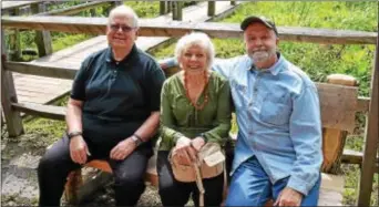  ??  ?? Colonial Pennsylvan­ia Plantation volunteers David & Pamela Stitely along with Bruce Snyder relax before a dedication ceremony to honor the Stitelys.