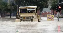  ??  ?? HOUSTON: A truck pushes through floodwater­s from Tropical Storm Harvey in Houston, Texas. — AP