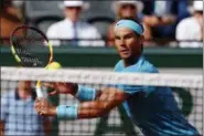  ?? THIBAULT CAMUS — THE ASSOCIATED PRESS ?? Spain’s Rafael Nadal returns the ball to Argentina’s Juan Martin Del Potro during their semifinal match of the French Open tennis tournament at the Roland Garros stadium, Friday in Paris.