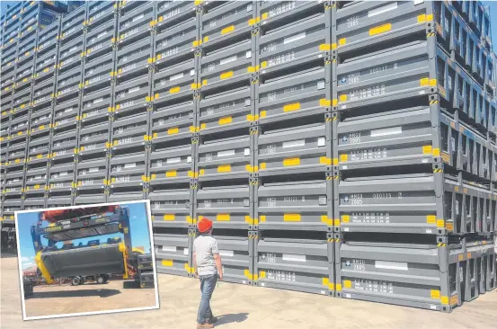  ??  ?? STACKING UP: A worker inspects MMG's specially designed half height containers ( inset) for the new Dugald River zinc mine.