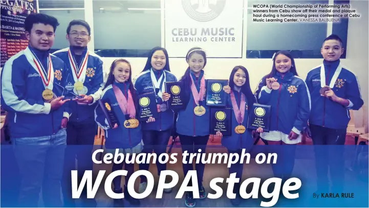  ?? VANESSA BALBUENA ?? WCOPA (World Championsh­ip of Performing Arts) winners from Cebu show off their medal and plaque haul during a homecoming press conference at Cebu Music Learning Center.