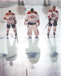  ?? ANDRE RINGUETTE / FREESTYLE PHOTO / GETTY IMAGES ?? Canadiens Brendan Gallagher, Carey Price and Ben Chiarot stand as the national anthem is played before Saturday’s game against the Pittsburgh Penguins in Toronto.