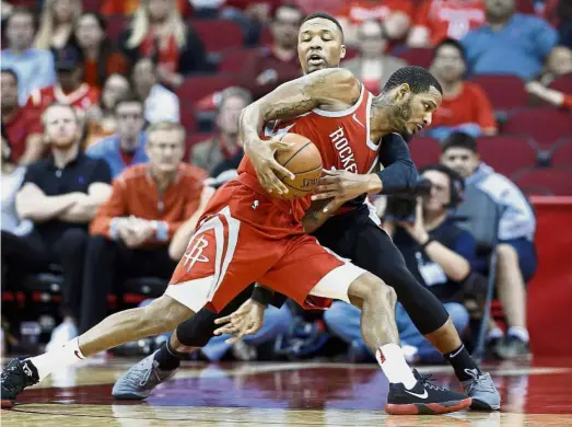  ??  ?? Out of my
way: Houston Rockets forward Trevor Ariza (front) in action against Portland Trail Blazers guard Damian Lillard during the NBA game on Wednesday,