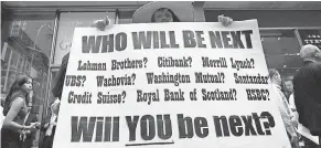  ??  ?? Protest in front of Lehman Bros. on Sept. 15, 2008, in New York. MARY ALTAFFER/AP