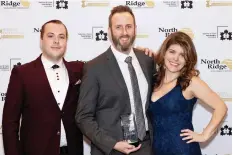  ??  ?? For a second consecutiv­e year, Daryl Shannon (centre) and the team at Delonix Homes received the Renovator of the Year award at the 27th annual SRHBA Housing Excellence Awards.