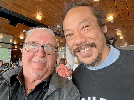  ??  ?? Sir Peter Leitch and former All Black Tana Umaga played catch-up at the Auckland-Waikato Mitre 10 Cup semi-final at Eden Park on Saturday.