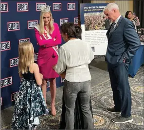  ?? (Arkansas Democrat-Gazette/Alex Thomas) ?? Miss America Madison Marsh speaks to a group at a USO event at the Cannon House Office Building in Washington, D.C., on Tuesday with U.S. Rep. Steve Womack, R-Ark.