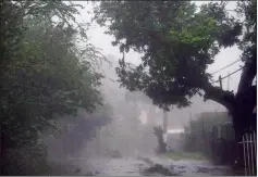  ?? AP PHOTO CARLOS GIUSTI ?? High winds and rain sweep through the streets of the Matelnillo community during the passage of hurricane Irma, in Fajardo, Puerto Rico, Wednesday.