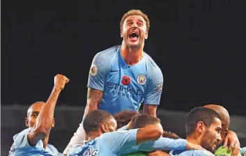  ?? AP ?? Manchester City’s Kyle Walker(top) celebrates after Ilkay Gundogan scored his side’s third goal during the Premier League against Manchester United at the Etihad on Sunday.