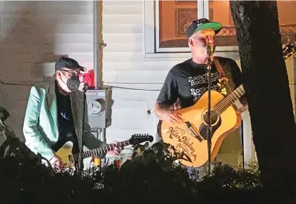  ?? BOB CHIARITO/FOR THE SUN-TIMES ?? Cheap Trick guitarist Rick Nielsen (left) and son Miles Nielsen playing in Ravenswood on Friday night.