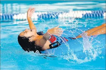  ?? Gary Coronado Los Angeles Times ?? ISABEL GONZALEZ, 11, of Los Angeles enjoys the cool water while taking junior lifeguard training at Celes King III swimming pool in L.A. on Monday, the first day of a heat wave expected to last through the week.