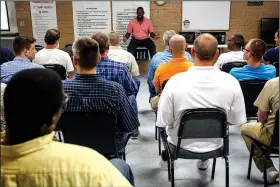  ?? Arkansas Democrat-Gazette/MITCHELL PE MASILUN ?? Sam Hammons, assistant director of Covenant Recovery in Malvern, speaks to prisoners during one of their group sessions at the center July 20.