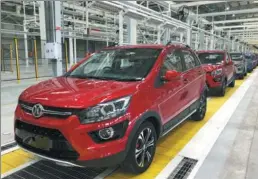  ?? PHOTOS PROVIDED TO CHINA DAILY ?? The first cars roll off the assembly line at BAIC Group’s production base in Port Elizabeth, South Africa,