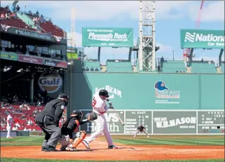  ?? GETTY IMAGES ?? Boston’s J.D. Martinez takes a swing during Friday’s loss to the Baltimore Orioles.