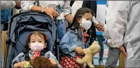  ?? Photo: Xinhua ?? A girl has her temperatur­e measured at a COVID-19 vaccinatio­n site in Times Square, New York, the United States, on June 22, 2022.