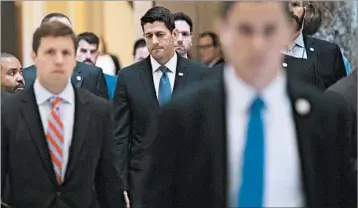  ?? SAUL LOEB/GETTY-AFP ?? House Speaker Paul Ryan, center, called for unity among his colleagues. “Show the world we are one House, the people’s House, united in our humanity,” he said.