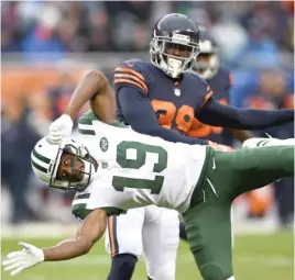  ?? STACY REVERE/GETTY IMAGES ?? Bears safety Eddie Jackson was penalized for unnecessar­y roughness for this hit on Jets wide receiver Andre Roberts in the fourth quarter.