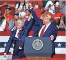  ?? PATRICK SEMANSKY/AP ?? Sen. Lindsey Graham, R-S.C., left, stands onstage with President Donald Trump on Feb. 28, 2020.