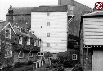  ??  ?? November 1965 - the side of the mill at East Hill prior to the fire showing the Mill House, timber-framed Provender Mill (left and centre) and the barrel roofed warehouse (right)