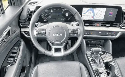  ?? STEPHANIE WALLCRAFT • POSTMEDIA ?? The interior of the 2023 Kia Sportage X-line Limited is stylish, with a dramatic curved housing containing the infotainme­nt screen and instrument cluster.