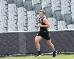  ??  ?? OUT AGAIN: Ollie Wines trains away from the main group at Port Adelaide’s training session.