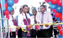  ??  ?? PLC Senior DGM Lionel Fernando unveiling the relocated PLC Dambulla branch. Also in the picture are Assistant General Manager Ranil Perera and Dambulla Branch Manager Dulip Thushantha
