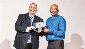  ??  ?? Award-winner: Prof Malachi (right) receiving the Vice-Chancellor’s achievemen­t Medal from then university of nottingham Malaysia vice provost (now provost and chief executive officer) Prof Graham Kendall.