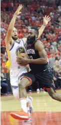  ?? DAVID J. PHILLIP/ AP ?? Rockets guard James Harden, who had 27 points Wednesday, drives past Warriors guard Stephen Curry, who was held to 16.