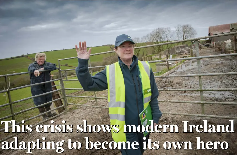  ??  ?? LINK TO THE OUTSIDE WORLD: Postwoman Bernie Ronan delivers vital services such as mail to farmer Con Foott who lives in Robert’s Cove, Co Cork. Photo: Daragh Mc Sweeney/Provision