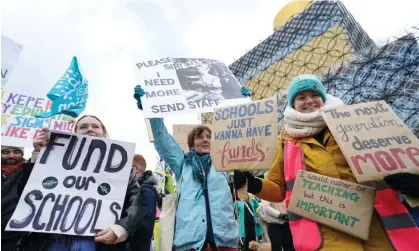  ?? ?? Striking teachers and their supporters rally in Birmingham city centre on Wednesday. Photograph: Jacob King/PA