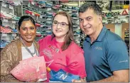  ?? Picture: MARK WEST ?? STRIDING AHEAD: Winner of the SPAR Women’s Challenge ‘I entered because’ online competitio­n Jenna Hills, centre, walks away with a new pair of running shoes valued at R1 500 courtesy of Action Sports. With her are SPAR Eastern Cape’s Roseann Shadrach,...