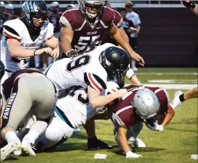  ?? TIMES photograph­s by Annette Beard ?? Blackhawk defenders Adam Trammell (No. 39) and Luis Reyes (No. 19) joined forces to stop the Panthers’ ball carrier.