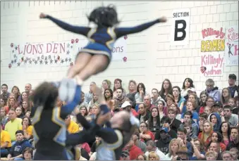  ?? TIM COOK/THE DAY ?? The crowd at Waterford High School watches Ledyard perform its routine at the ECC cheerleadi­ng championsh­ips on Saturday afternoon. The Colonels finished second to Fitch in the Large Division. Go to www.theday.com for a photo gallery.