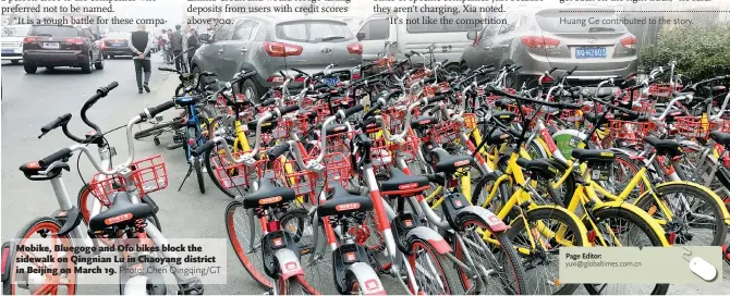  ??  ?? Mobike, Bluegogo and Ofo bikes block the sidewalk on Qingnian Lu in Chaoyang district in Beijing on March 19.