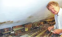  ??  ?? Labour of love: Ian Lindleyatw­ork on hisOO- gauge layout that will recreate the former GERLiverpo­ol Street to Bethnal Green stretch ofmain line inthe 1930s. JILL LINDLEY