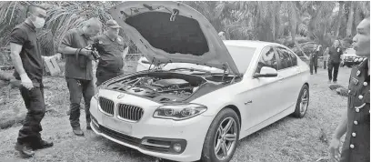  ?? — Gambar Bernama ?? BAHAN BUKTI: Kereta jenis BMW 520D yang dipercayai digunakan suspek dalam kejadian bunuh di sebuah stesen minyak di Taman Pelangi pada 17 Disember lepas.