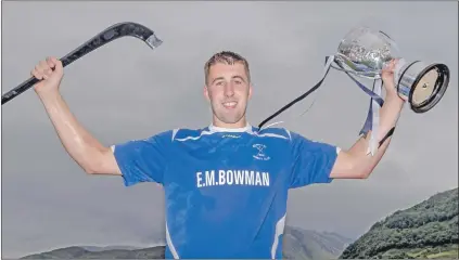  ?? Photo: Neil Paterson ?? Kilmallie captain Liam Macdonald with the Liberty British Aluminium Balliemore Cup.