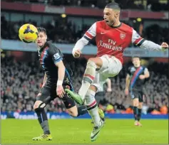  ?? Picture: AFP ?? SLICK MOVES: Arsenal’s English midfielder Alex Oxlade-Chamberlai­n, right, during the match between Arsenal and Crystal Palace at the Emirates Stadium