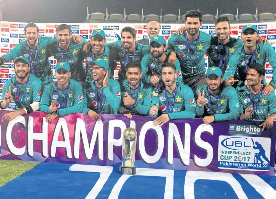  ??  ?? Pakistan players celebrate after defeating the World XI team in Lahore.