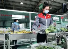  ?? YUETIKEER NIJIATI / FOR CHINA DAILY ?? A worker packages vegetables in Shufu county, Xinjiang Uygur autonomous region, on Monday. The local government is ensuring daily necessitie­s remain well stocked despite an outbreak of asymptomat­ic COVID- 19 cases.