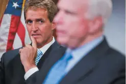  ??  ?? Senators Jeff Flake and John McCain at the Capitol, June 2014