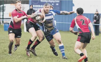  ??  ?? Mark Boothroyd tries to shrug off a rival at Chevinedge last Saturday
Pictures: Jim Fitton