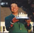  ?? Associated Press ?? CHAMP — Hideki Matsuyama, of Japan, holds the trophy after winning the Masters on Sunday in Augusta, Ga.