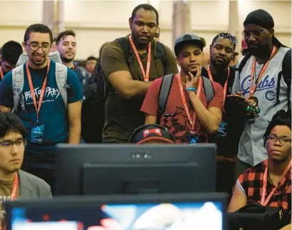  ?? JOE BUGLEWICZ/GETTY ?? Spectators cheer on gamers during day one of the Evolution Championsh­ip Series at Mandalay Bay Resort and Casino in August 2019 in Las Vegas. The gamer mentality pervades our culture, David Brooks writes.