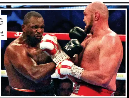  ?? AFP ?? King of England: Fury salutes the Wembley crowd after halting Whyte with a brutal uppercut (right)