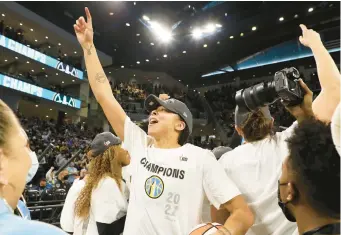  ?? STACEY WESCOTT/CHICAGO TRIBUNE ?? Candace Parker celebrates after the Chicago Sky win the 2021 WNBA championsh­ip.