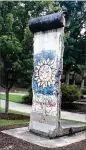  ?? KATHRYN KICKLITER / FOR AJC ?? Part of the BerlinWall is located on the KSU campus in Kennesaw.