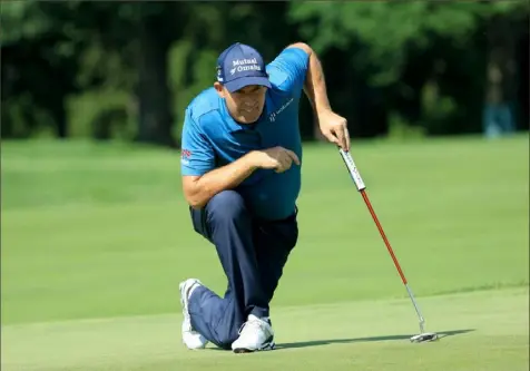  ?? Sam Greenwood/Getty Images ?? Padraig Harrington lines up a putt Saturday in the third round of the U.S. Senior Open at Saucon Valley Country Club in Bethelehem, Pa. Harrington shot a 66 en route to opening a five-shot lead.