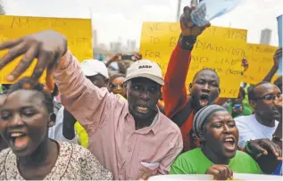  ?? DAI KUROKAWA, EUROPEAN PRESSPHOTO AGENCY ?? Kenyan activists shout slogans against the Health Ministry as they demand better service in Nairobi on Feb. 24. This nation of 44 million has two doctors per every 10,000 people.